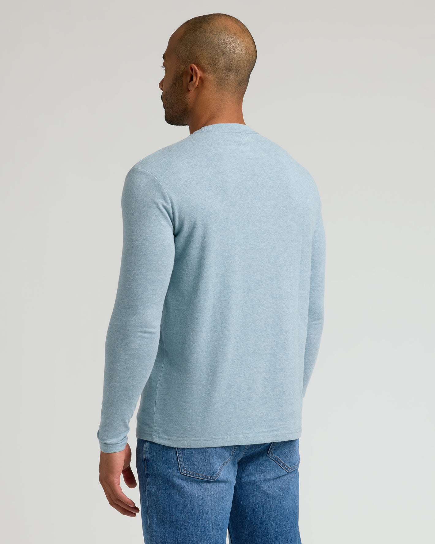Heather Sapphire Classic Long Sleeve Crew Neck from behind, highlighting fit and style.