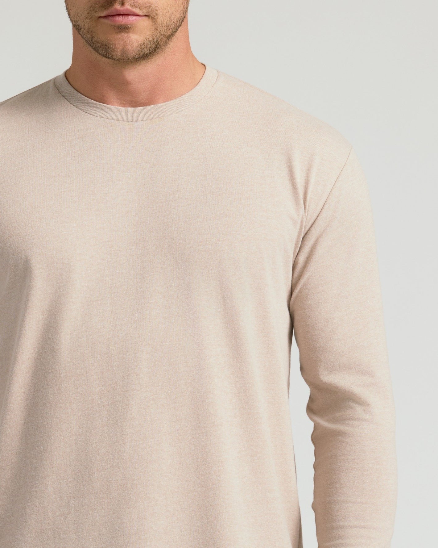 Heather Truffle Classic Long Sleeve Crew Neck on man, showcasing athletic fit.