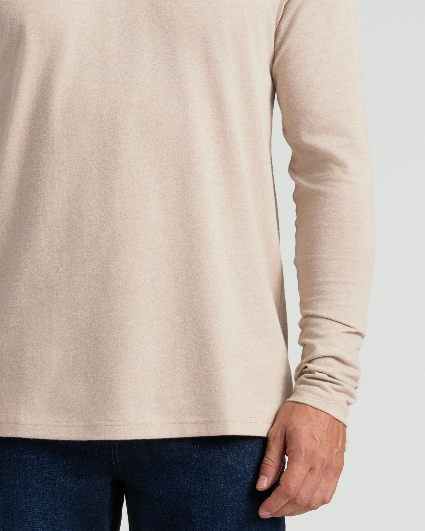 Heather Truffle Classic Long Sleeve Crew Neck in beige, shown with dark jeans.