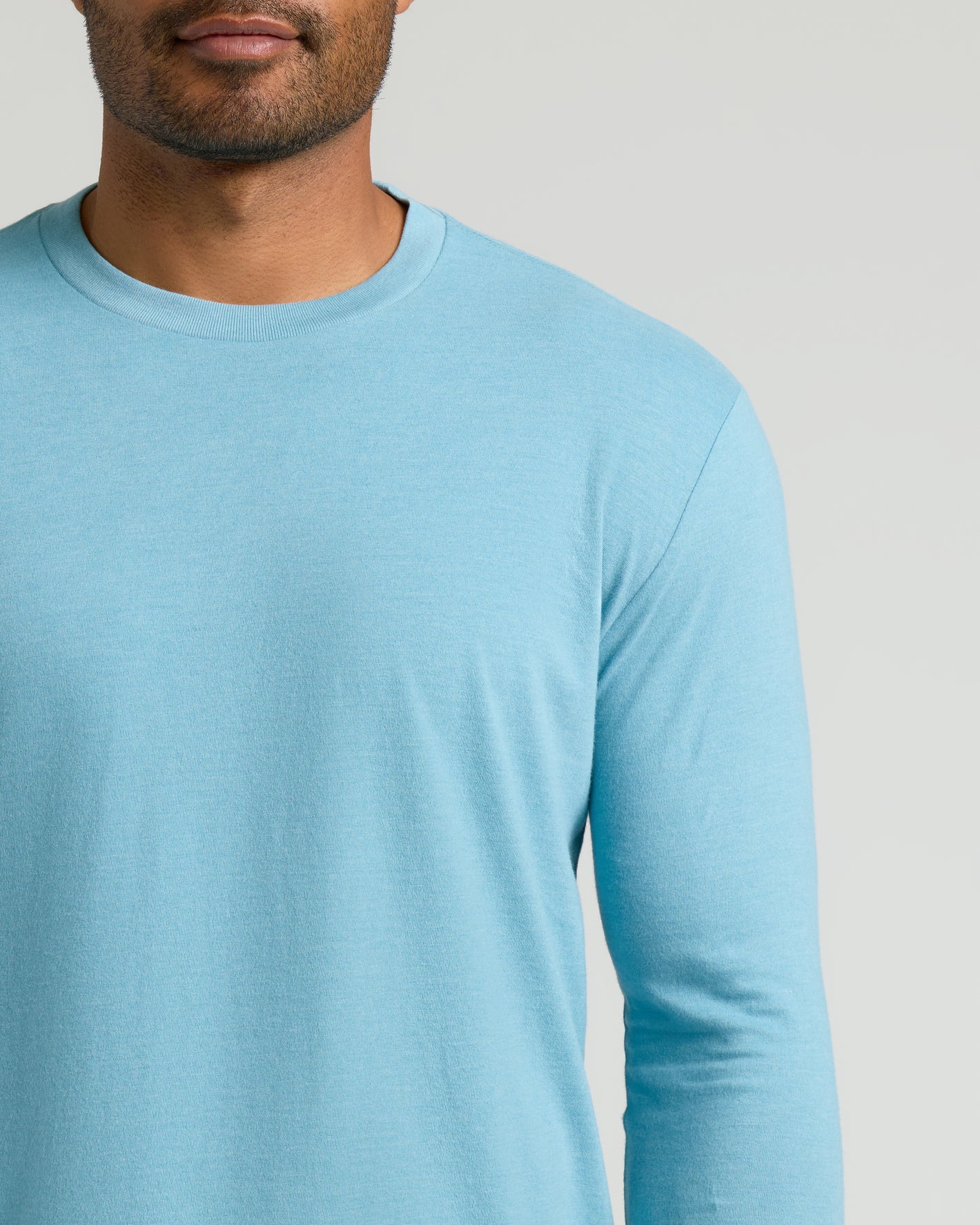Heather Voyager Classic Long Sleeve Crew Neck on a man, jawline visible.
