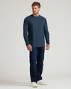 Classic Long Sleeve Crew Neck 10-Pack modeled in navy shirt and jeans.