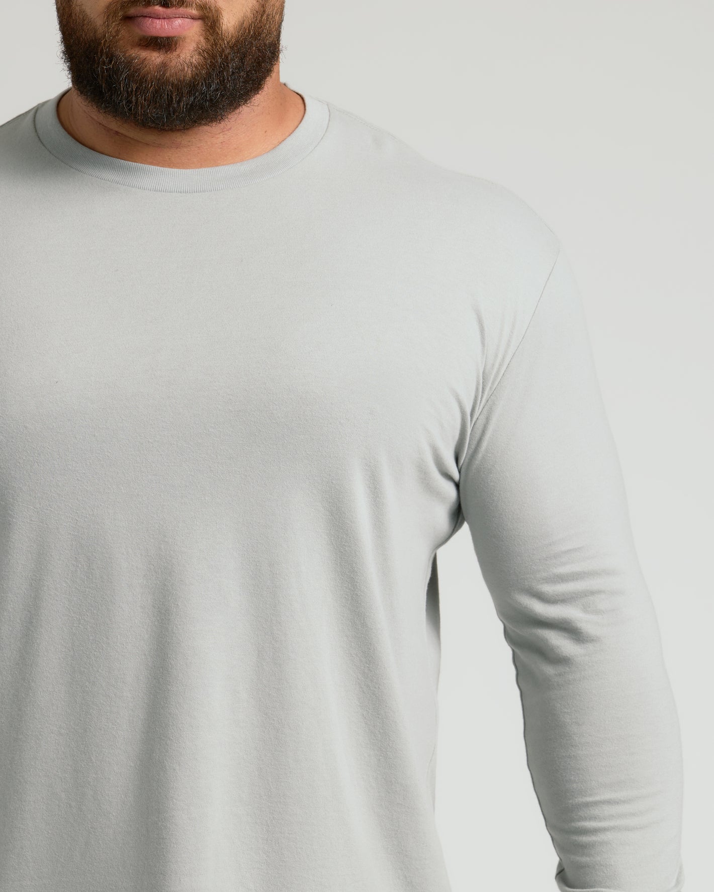 Man wearing Steel Classic Long Sleeve Crew Neck, light-gray, athletic fit.