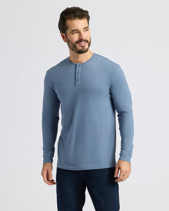 True ClassicMan wearing Dark Heather Vintage Navy Classic Long Sleeve Henley, smiling slightly.