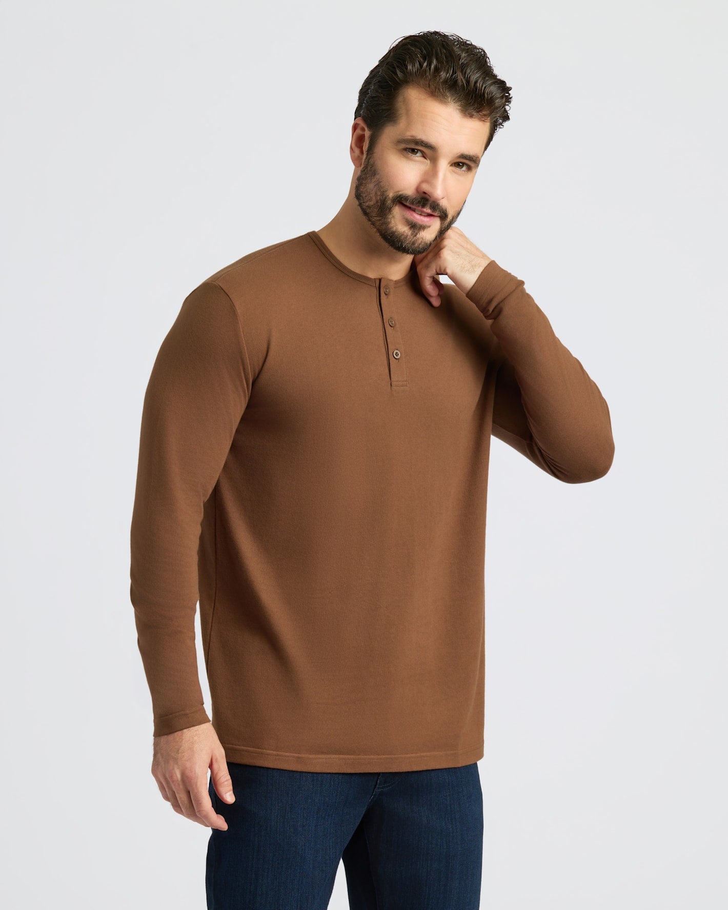 Sepiawood Classic Long Sleeve Henley on smiling model with dark jeans.