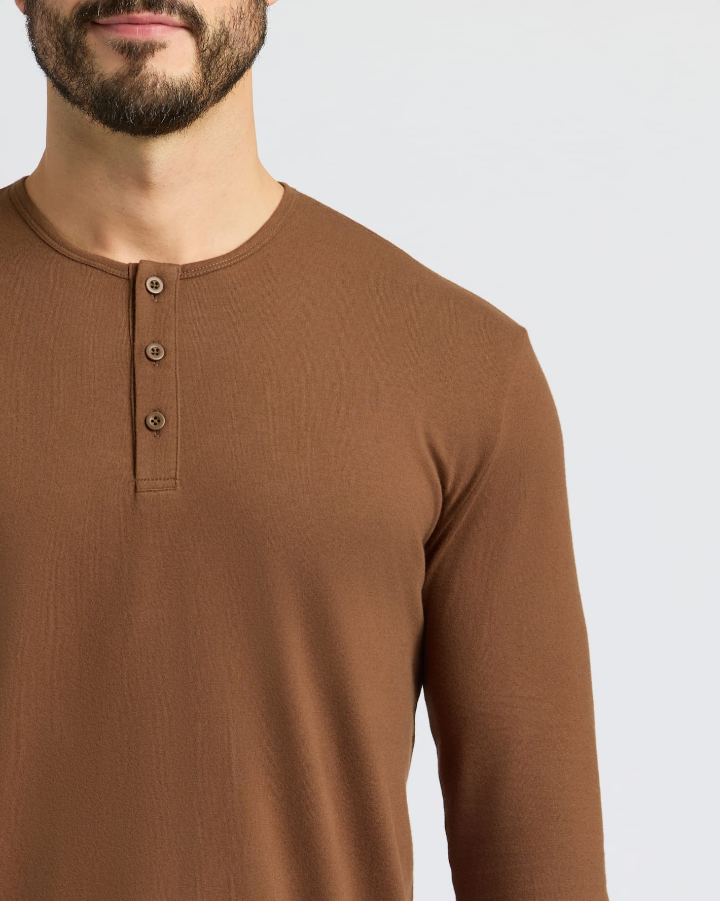 Sepiawood Classic Long Sleeve Henley on man, showcasing its three-button placket.