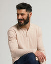 Man wearing Heather Camel Classic Long Sleeve Henley, relaxed pose.