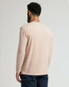 Back view of man wearing Heather Camel Classic Long Sleeve Henley.