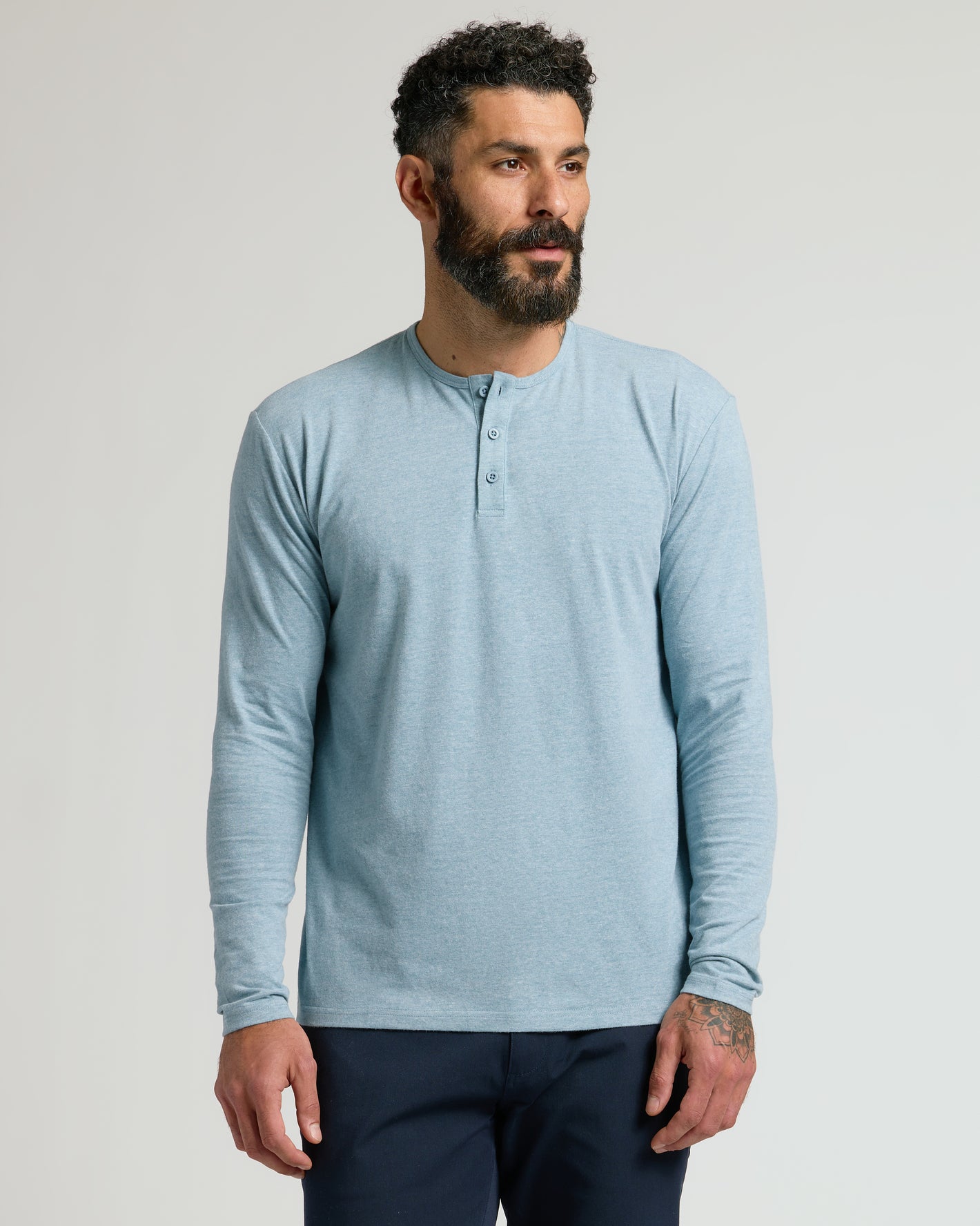 Heather Sapphire Classic Long Sleeve Henley worn by a bearded man.