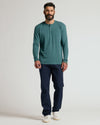 Model in Heather Seafarer Classic Long Sleeve Henley and navy trousers.