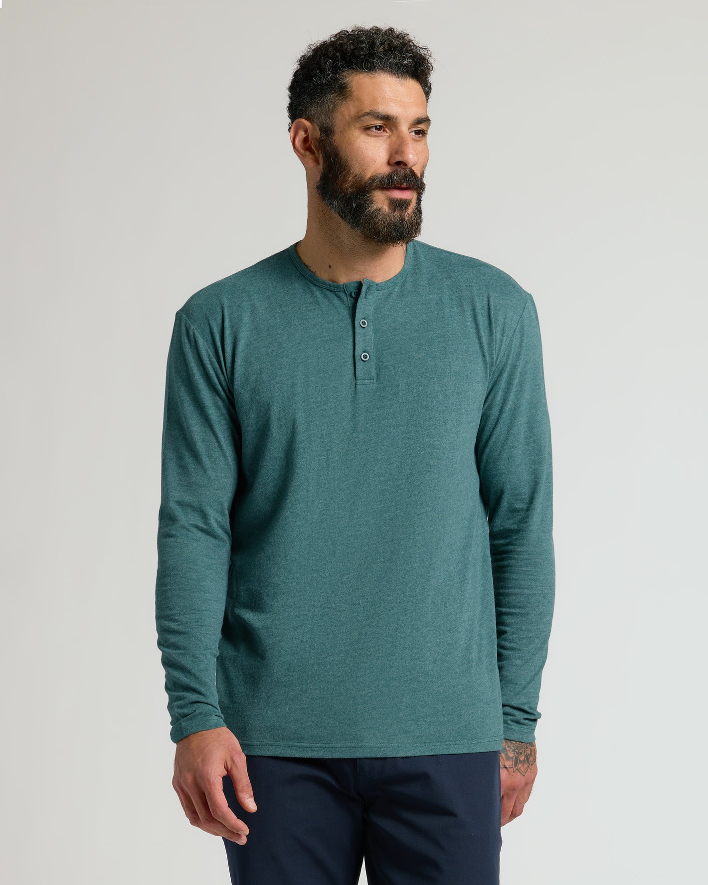 Model in Heather Seafarer Classic Long Sleeve Henley, showcasing fit and style.