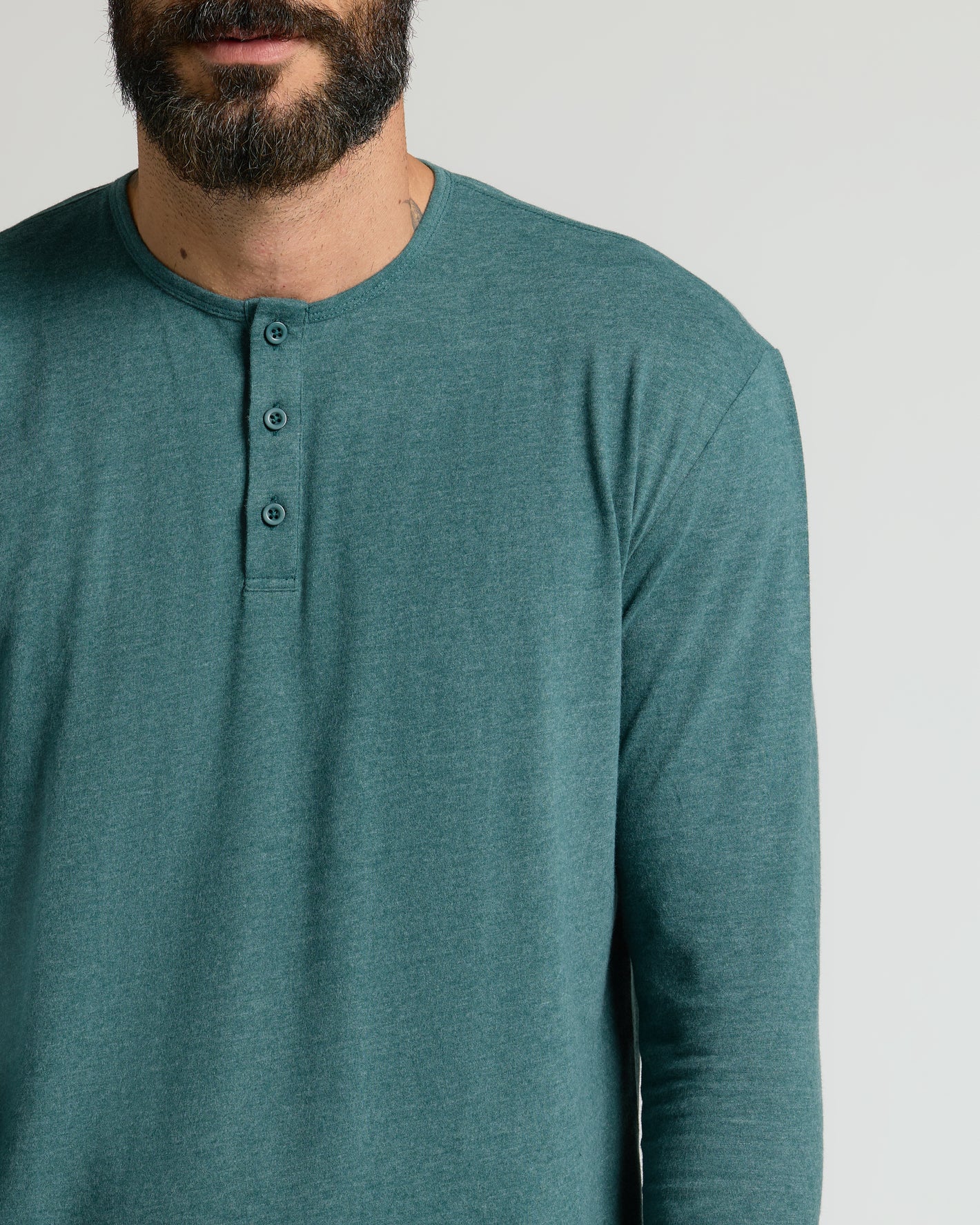 Heather Seafarer Classic Long Sleeve Henley worn by man, showcasing fit.