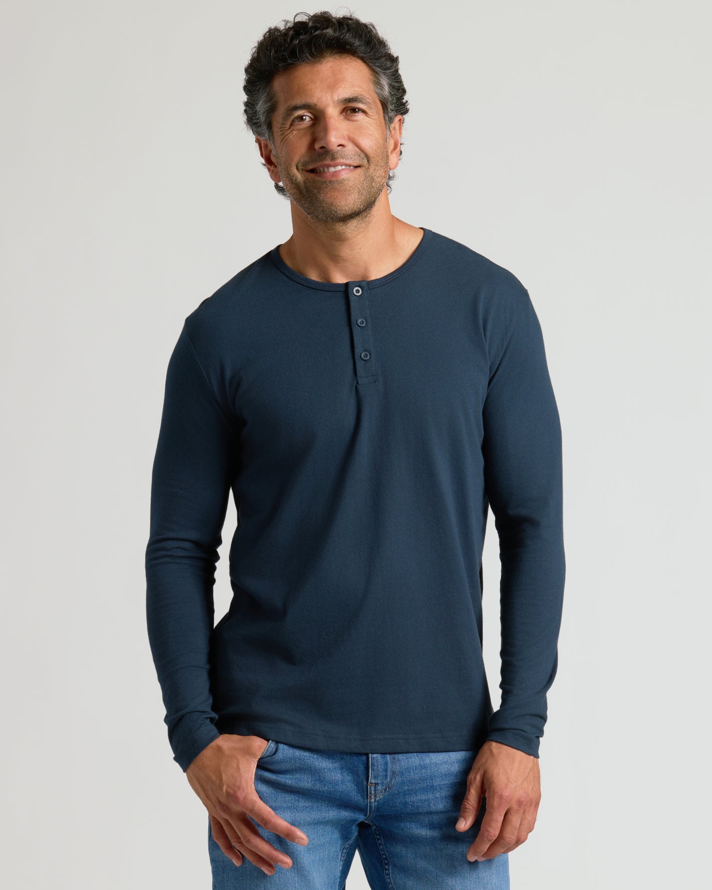 Classic Henley 3-Pack modeled in a relaxed pose, showcasing the navy shirt.