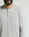 Steel Classic Long Sleeve Henley on man, showcasing buttons and light-gray fabric.