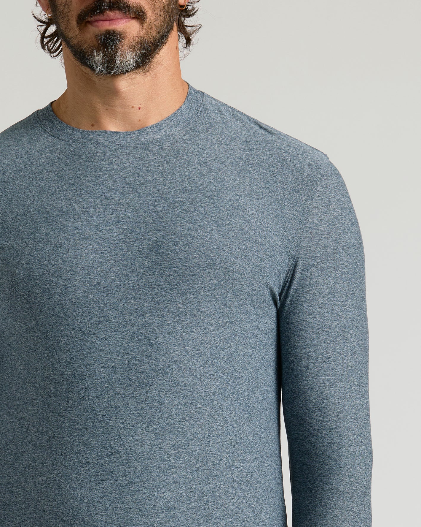 Man wearing Active Long Sleeve Crew 3-Pack shirt against light background.