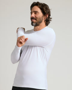 True ClassicMan in All White Active Long Sleeve Crew stretching shoulder.