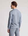 Person wearing Dusty Blue Fleece French Terry Pullover Crew Neck and matching sweatpants.