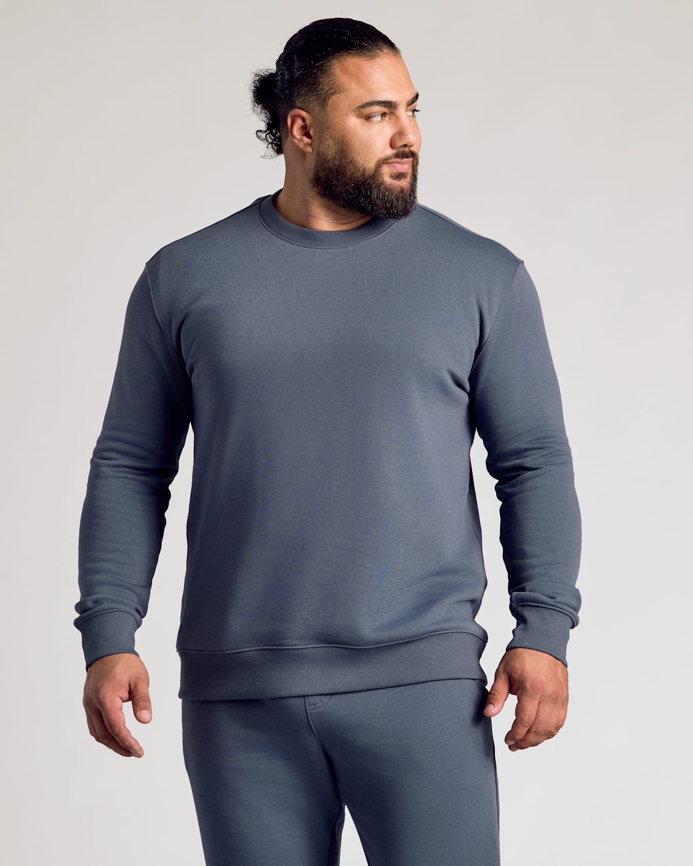 Man wearing Stormy Fleece French Terry Pullover Crew Neck.