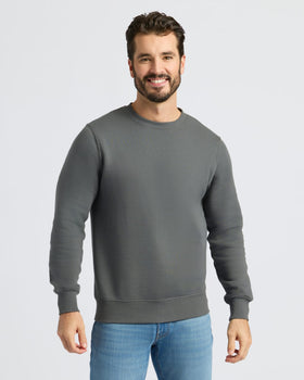 Man in Carbon Fleece French Terry Pullover Crew Neck sweatshirt.