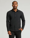 Man in Staple Long Sleeve Performance Dress Shirt, hands relaxed.