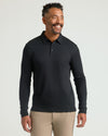 Man wearing Black Long Sleeve Premium Pima Polo, showcasing its fit.
