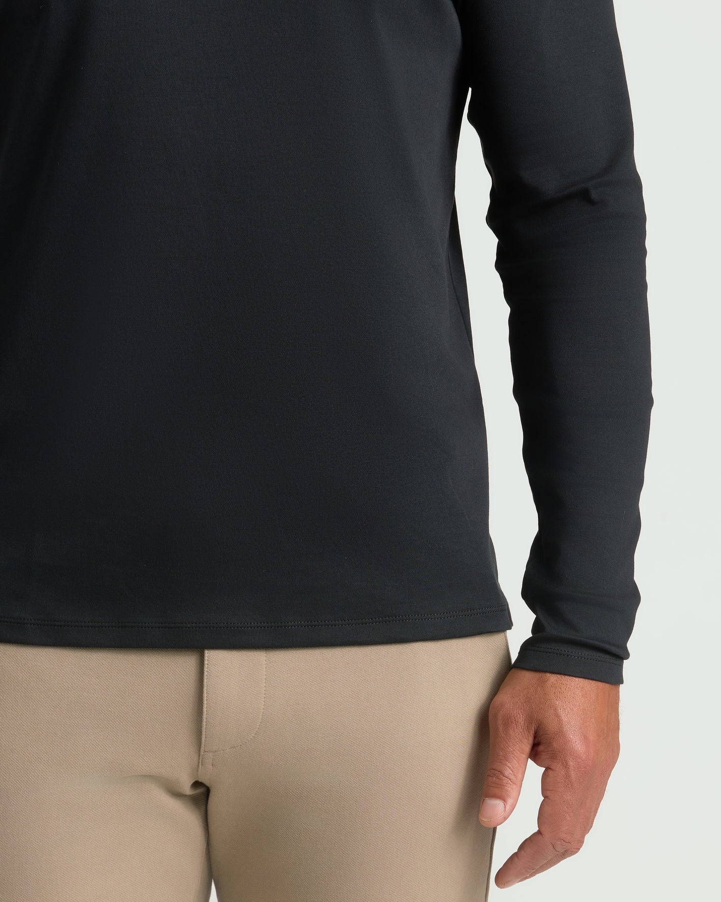 Black Long Sleeve Premium Pima Polo tucked into tan trousers.