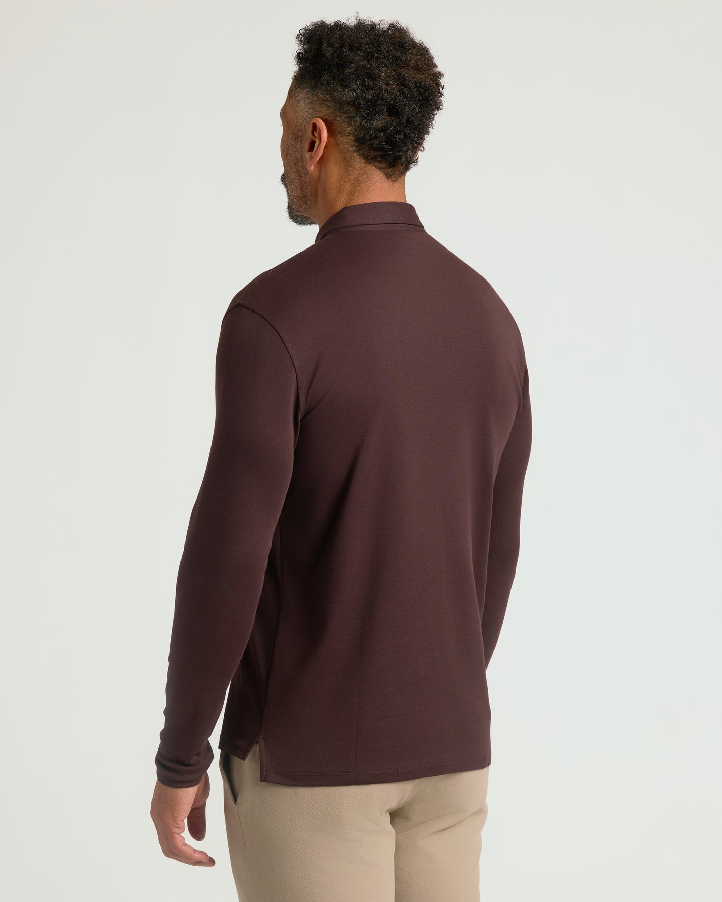 Man wearing All Java Long Sleeve Premium Pima Polo, showcasing its fit.