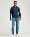 Man wearing All Navy Long Sleeve Premium Pima Polo, smiling.