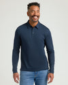 Man wearing All Navy Long Sleeve Premium Pima Polo, smiling.