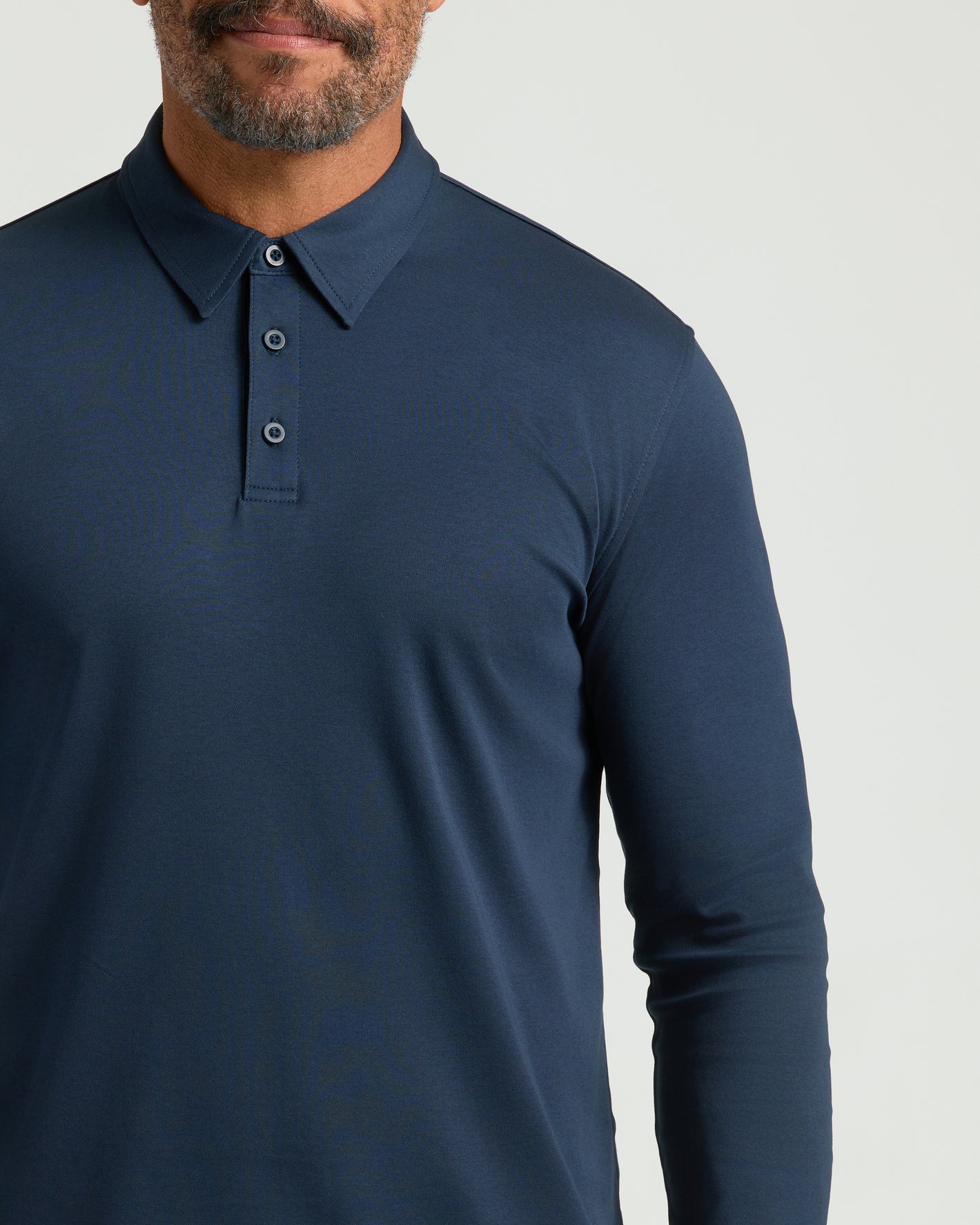 All Navy Long Sleeve Premium Pima Polo on model.