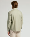 Model in Mossy Oak Long Sleeve Linen Shirt, back view.