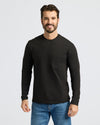 Man in Black & Navy Heavyweight Long Sleeve Pocket Crew, smiling.