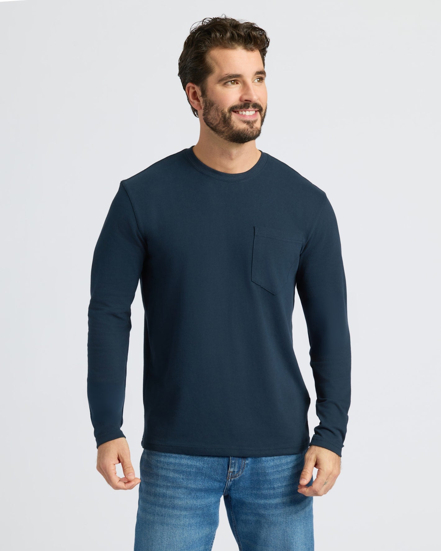 Navy Heavyweight Long Sleeve Pocket Crew worn by man smiling.