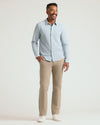 Man in Juniper Stripe Classic Stretch Oxford 2.0, khakis, sneakers.