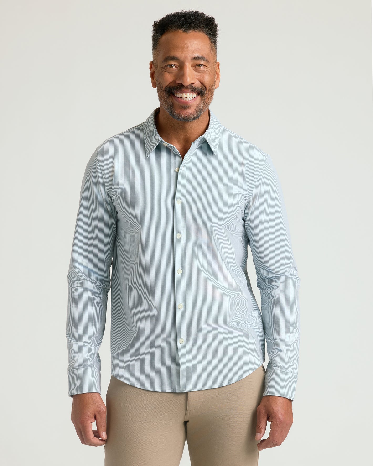 Juniper Stripe Classic Stretch Oxford 2.0 on smiling model in business casual attire.