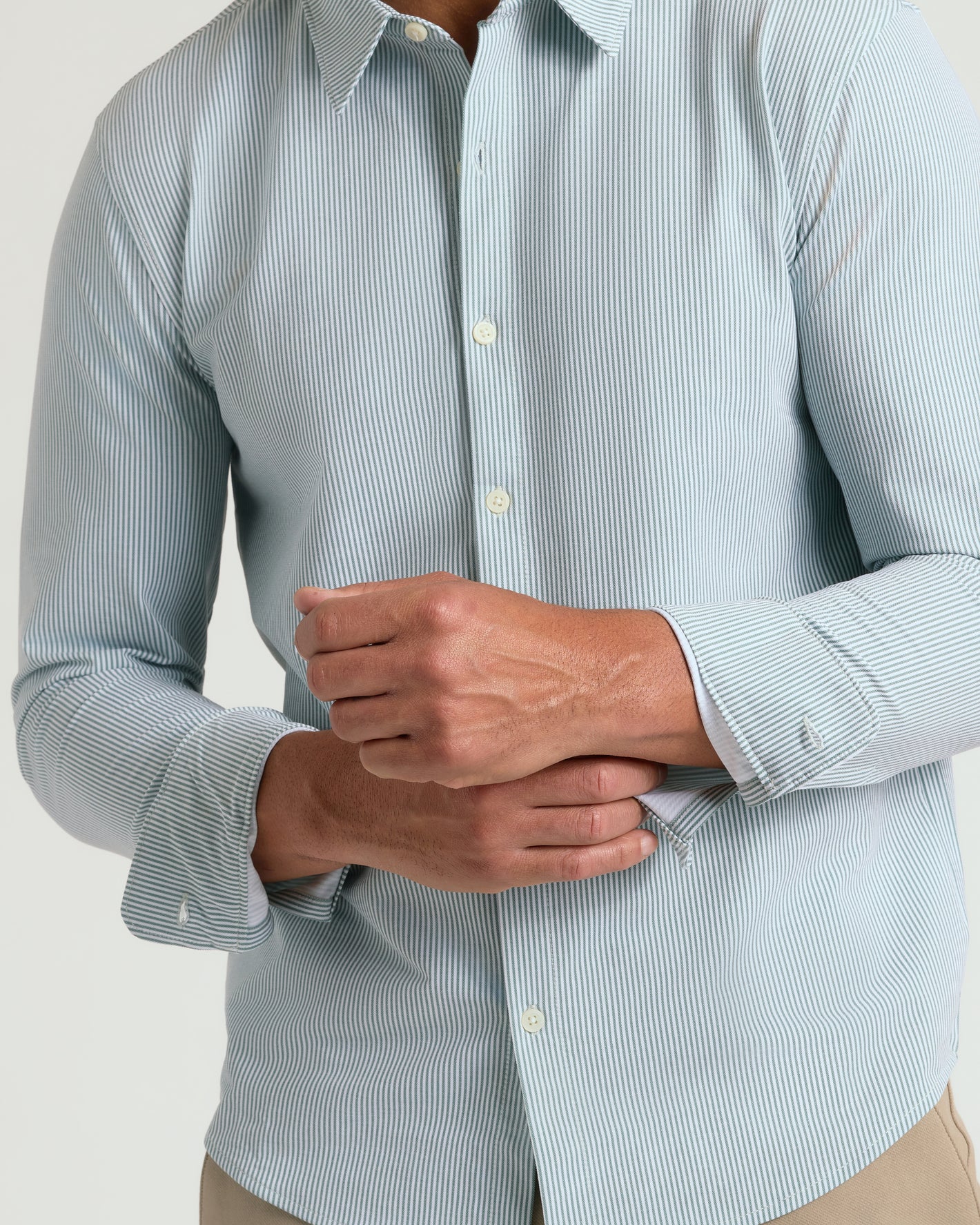 Man adjusts cuff of Juniper Stripe Classic Stretch Oxford 2.0.