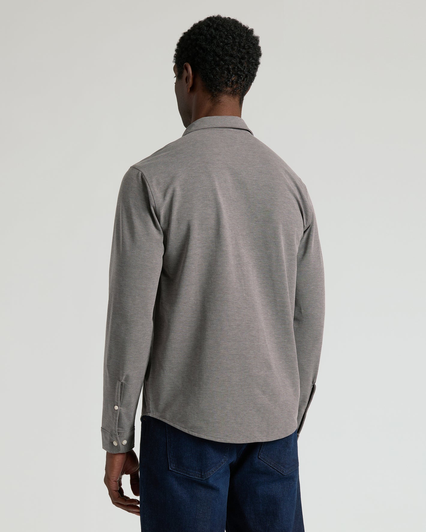 Back view of person in Oak Stretch Oxford 2.0 shirt.