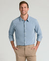 Man models Blue Stretch Oxford 2.0, showcasing its smart-casual style.
