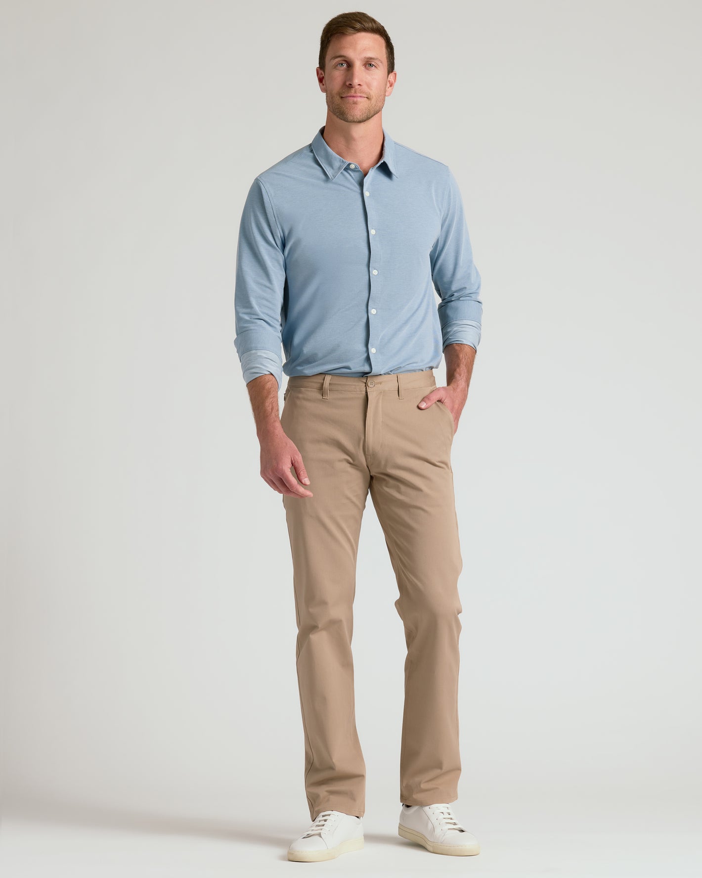 Man in Blue Stretch Oxford 2.0, khakis, white sneakers.