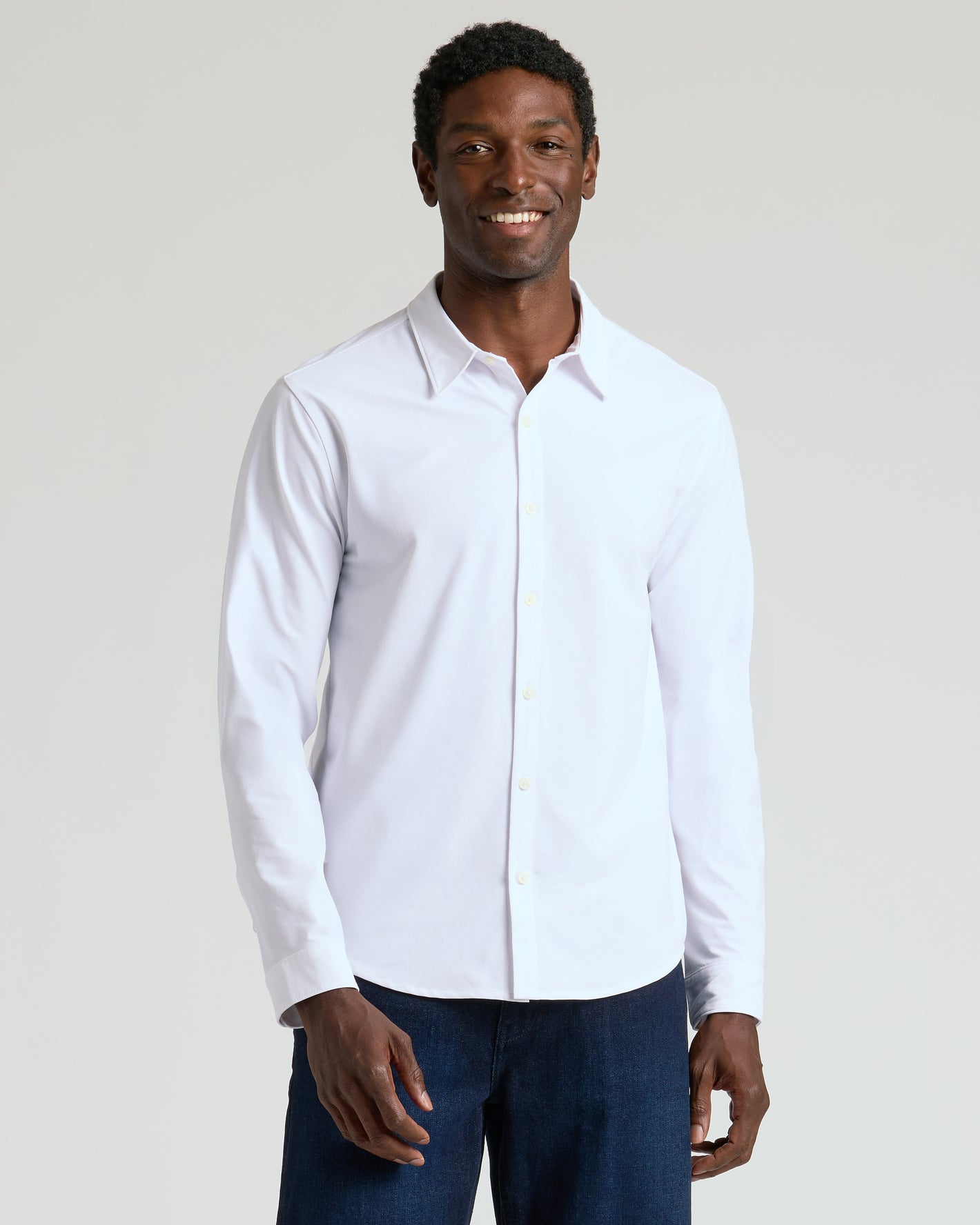 White Stretch Long Sleeve Modern Knit Oxford 2-Pack worn by smiling man.