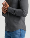 Charcoal Heather Gray Long Sleeve Flannel Shirt, relaxed fit, hands clasped.