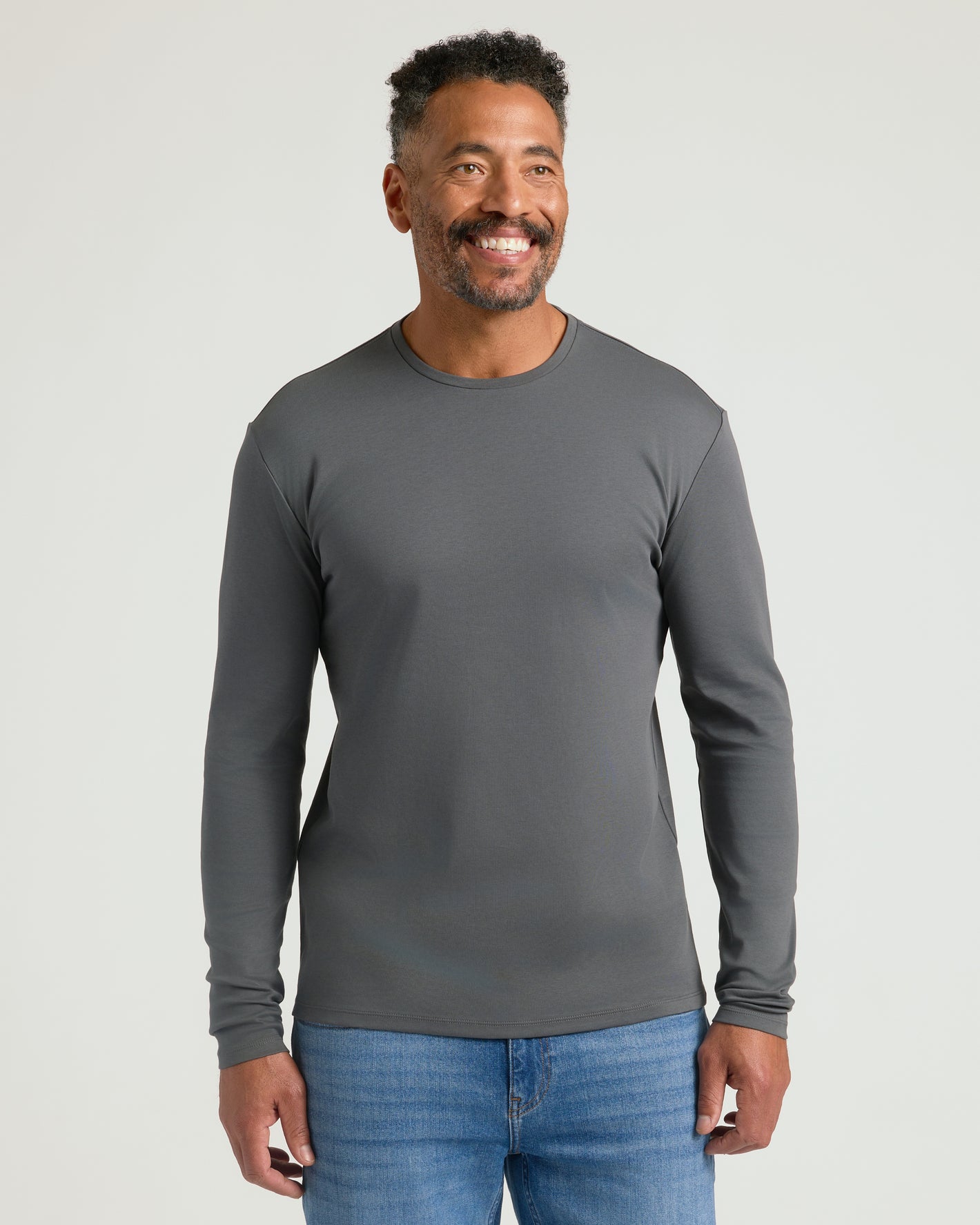 Man wearing Black & Carbon Premium Pima Long Sleeve Crew T-shirt.