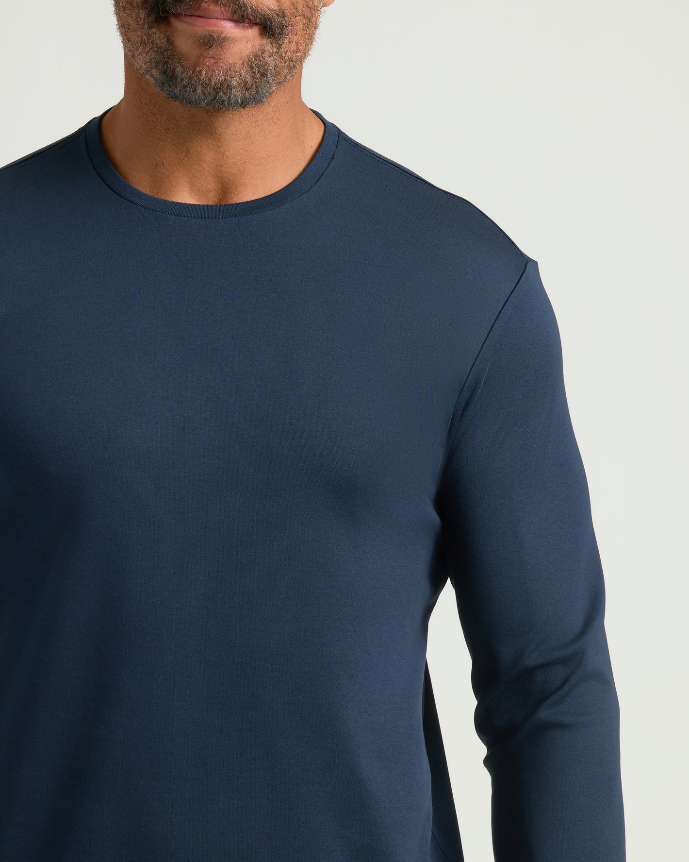 Navy Premium Pima Long Sleeve Crew worn by a man.