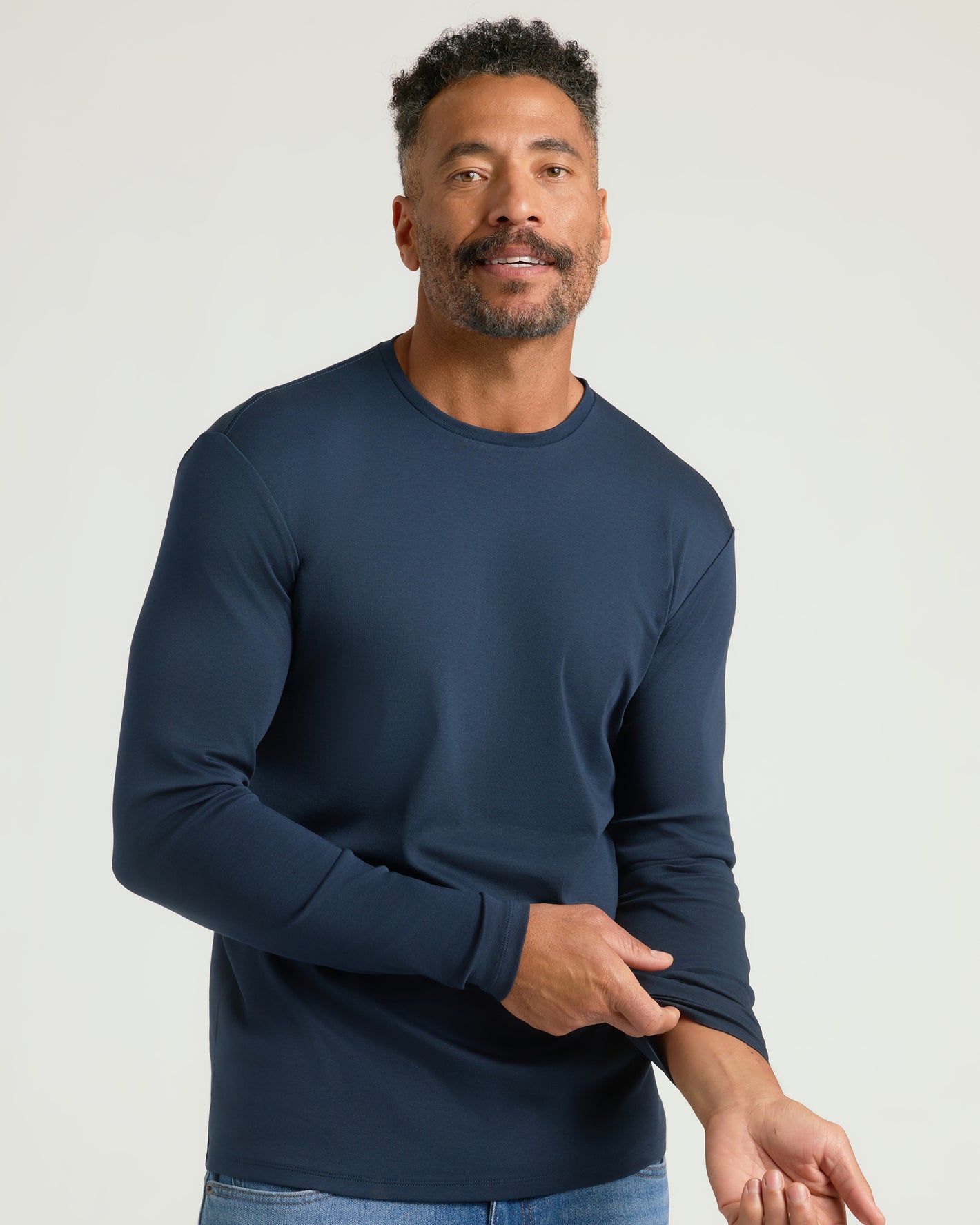 Man in Premium Pima Long Sleeve Crew, navy, showcasing fit and comfort.