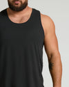 All Black Active Mesh Tank 6-Pack on bearded man, showcasing sleek athletic fit.