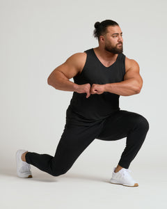 True ClassicMan wearing All Black Active Mesh Tank in lunge position.