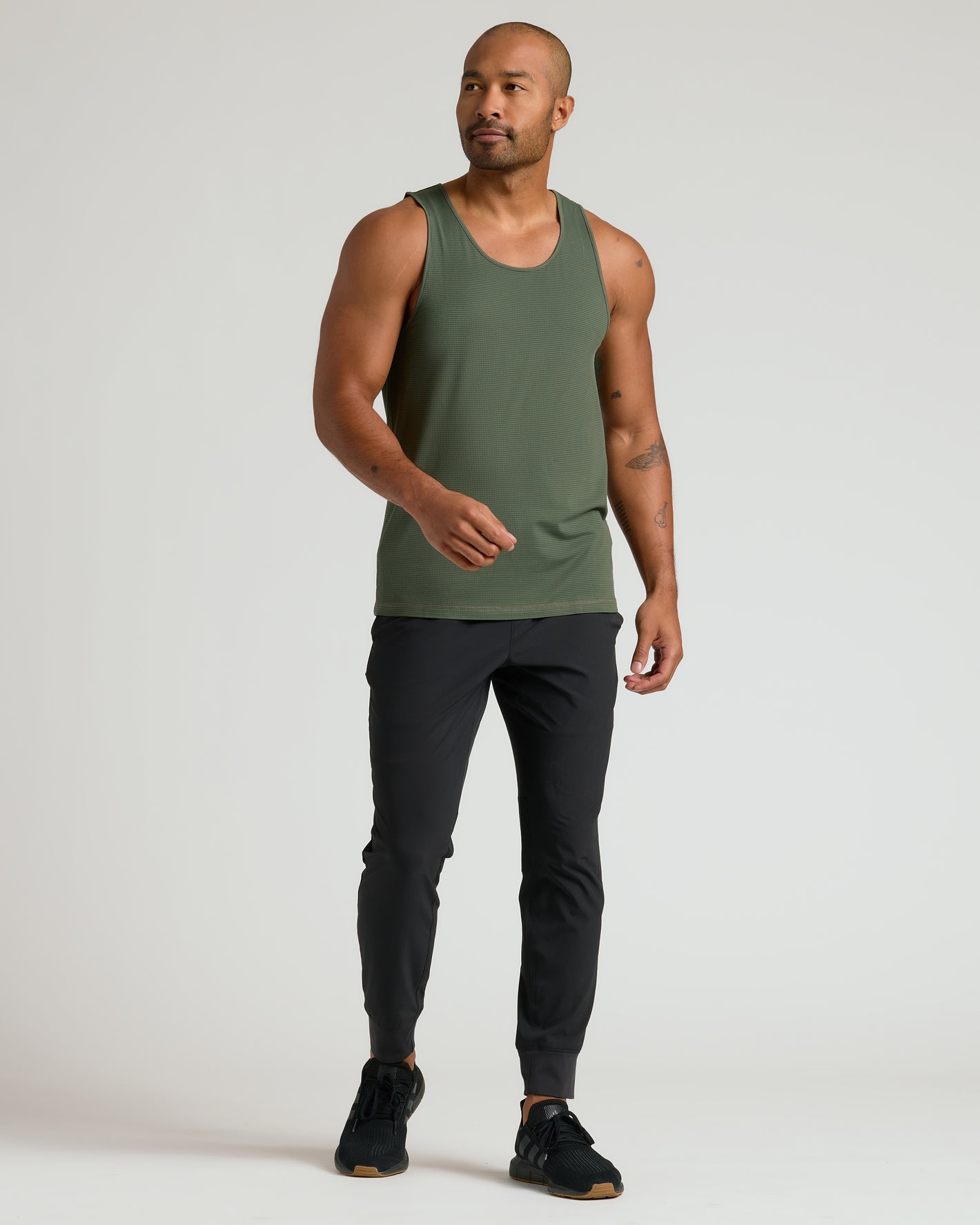 Model in Kelp Sleeveless Active Mesh Tank, showcasing athletic fit and style.