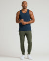 Man wearing All Navy Active Mesh Tank, showcasing its athletic fit and style.