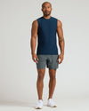 Man wearing Dark Heather Navy Sleeveless Active Muscle Tee in relaxed pose.