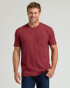 Man wearing Seasonal Classic Pocket Crew 3-Pack T-shirt, smiling.