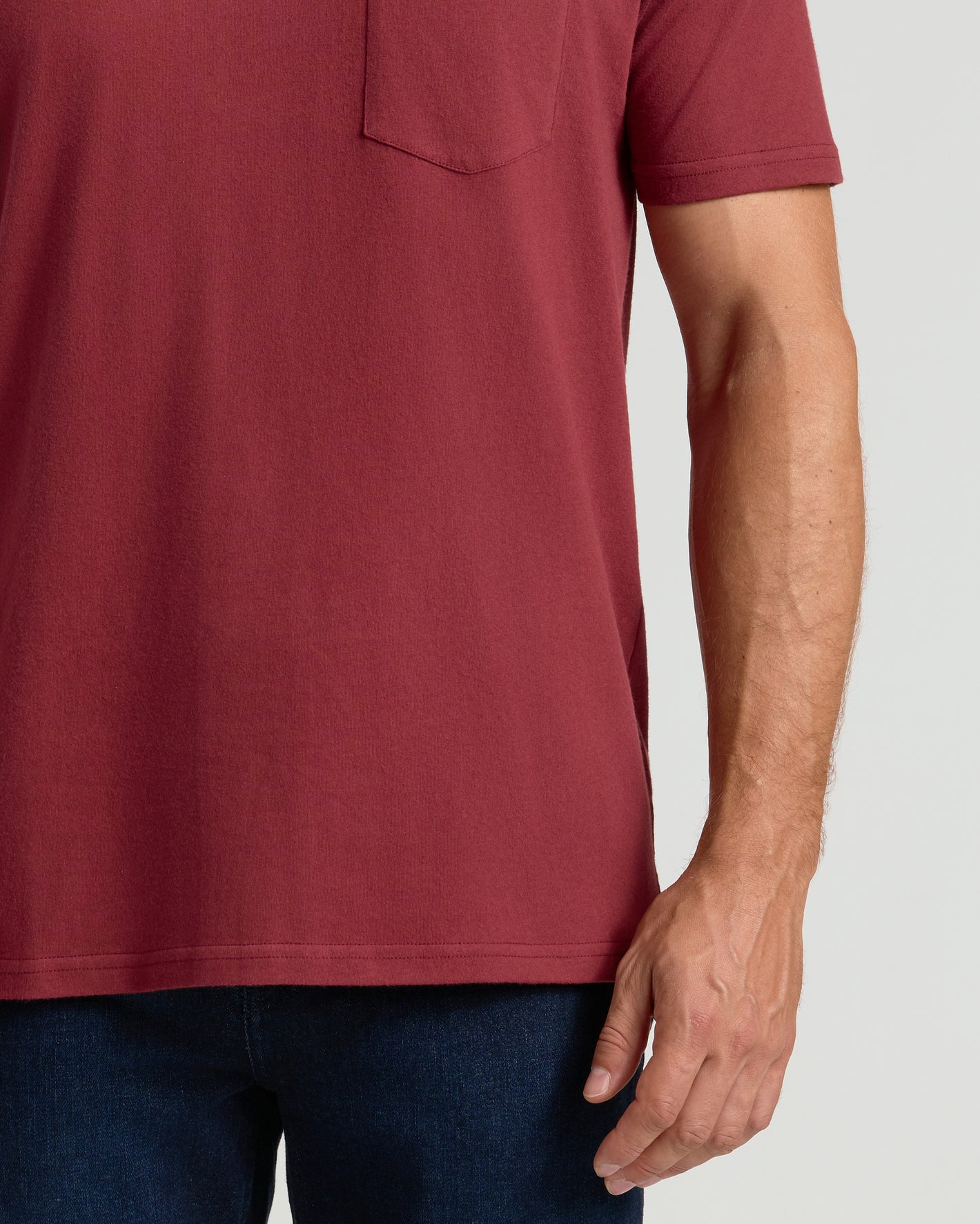 Claret Pocket Crew Tee with chest pocket shown in midsection view.